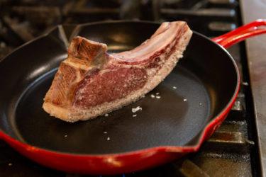 Barkshire pork chop standing in pan